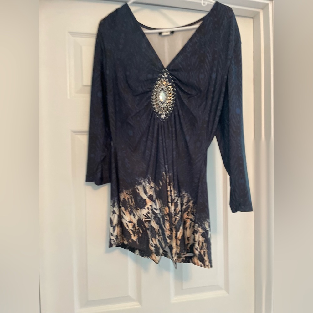Worn one time. Super silky material and very flattering